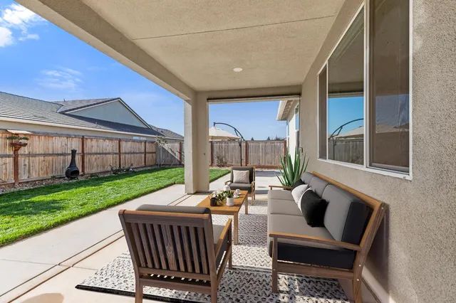 a outdoor living space with patio furniture and garden