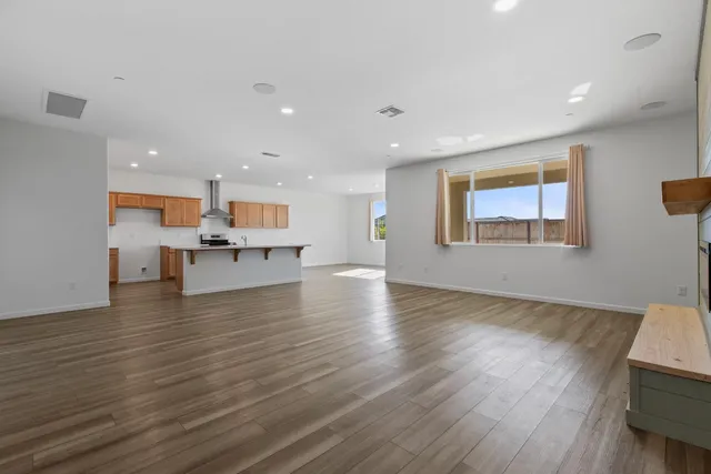 a view of kitchen and dining room with wooden floor