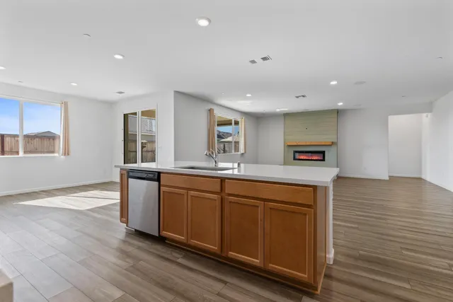 a view of a hallway with toilet and shower