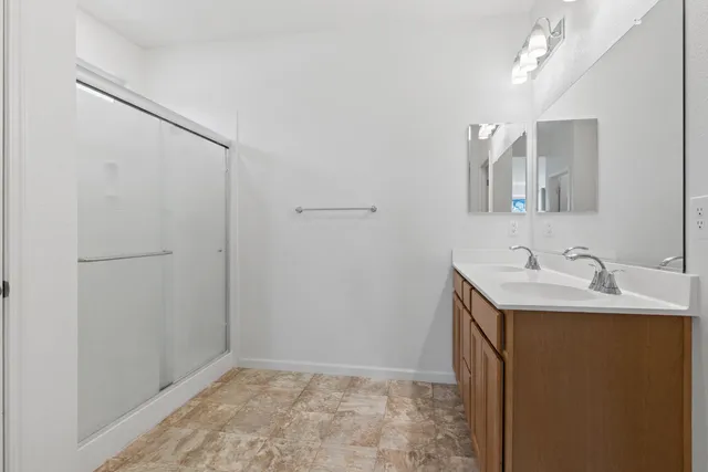 a view of house with backyard and glass windows