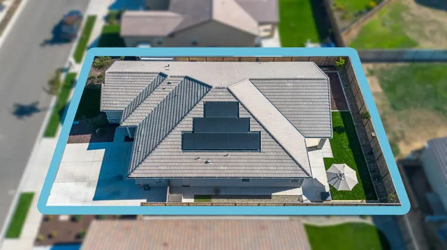 a view of houses with a yard