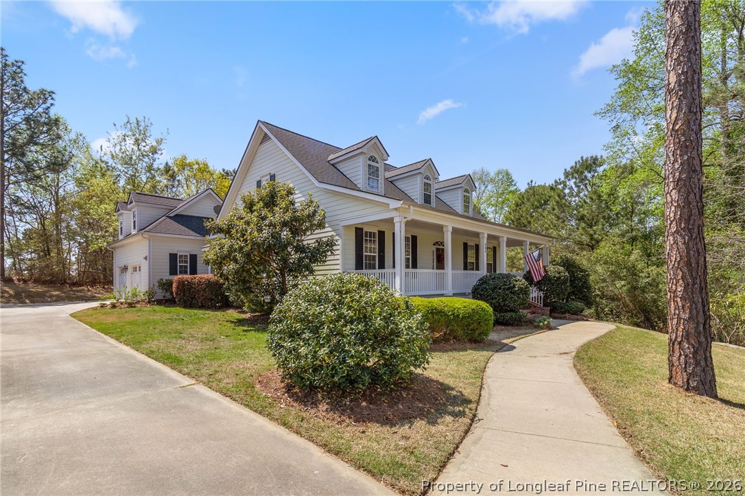 809 Kensington Park Road Fayetteville, NC 28311 - Photo 2 of 12 a front view of a house with garden