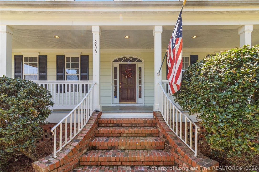 809 Kensington Park Road Fayetteville, NC 28311 - Photo 3 of 12 a view of a house with wooden floor and bench