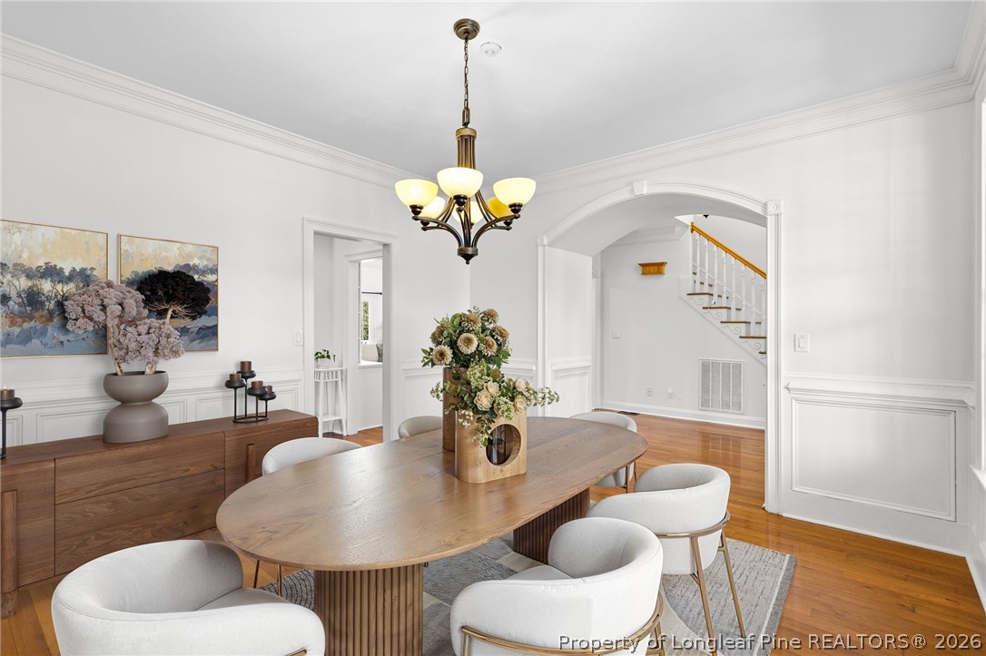 809 Kensington Park Road Fayetteville, NC 28311 - Photo 6 of 12 a dining room with furniture and wooden floor