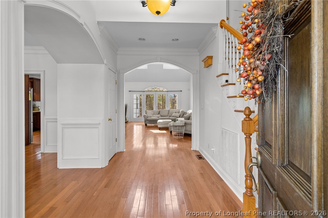 809 Kensington Park Road Fayetteville, NC 28311 - Photo 8 of 12 a view of a hallway view with living room and wooden floor