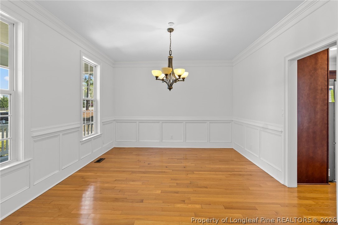 809 Kensington Park Road Fayetteville, NC 28311 - Photo 9 of 12 a view of a room with wooden floor and window