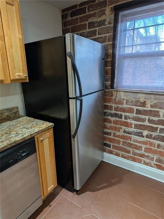 24 Daniel Street Southeast, Unit 4 Atlanta, GA 30312 - Photo 11 of 19 a kitchen with a refrigerator and a stove