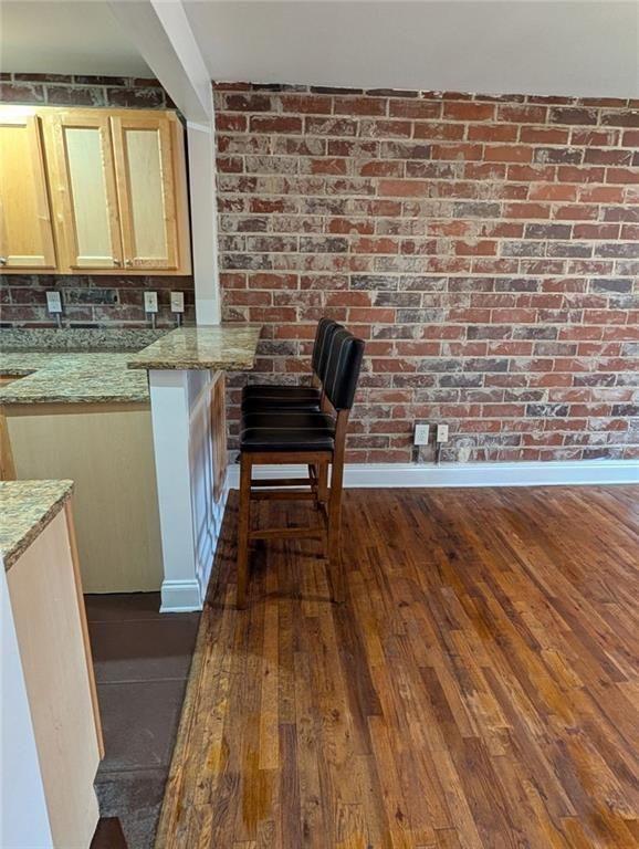 24 Daniel Street Southeast, Unit 4 Atlanta, GA 30312 - Photo 12 of 19 a view of a kitchen with wooden floor and a sink