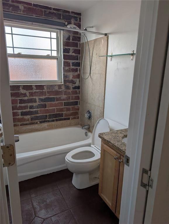 24 Daniel Street Southeast, Unit 4 Atlanta, GA 30312 - Photo 15 of 19 a bathroom with a granite countertop toilet sink and shower