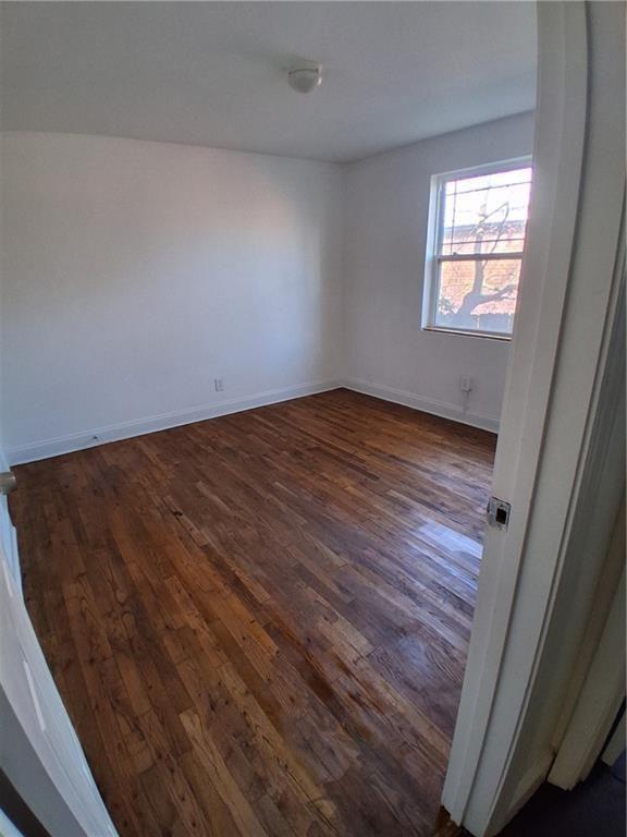 24 Daniel Street Southeast, Unit 4 Atlanta, GA 30312 - Photo 16 of 19 an empty room with wooden floor and windows