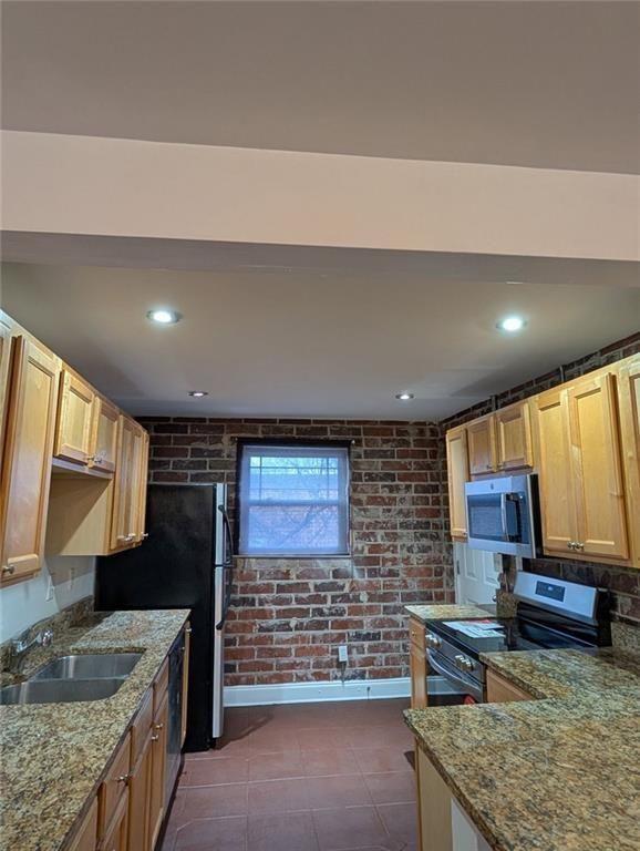 24 Daniel Street Southeast, Unit 4 Atlanta, GA 30312 - Photo 8 of 19 a kitchen with stainless steel appliances granite countertop a sink stove and granite counter top