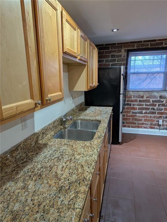 24 Daniel Street Southeast, Unit 4 Atlanta, GA 30312 - Photo 9 of 19 a kitchen with a sink stove and cabinets