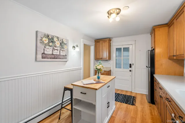 a kitchen with stainless steel appliances a stove cabinets and a sink