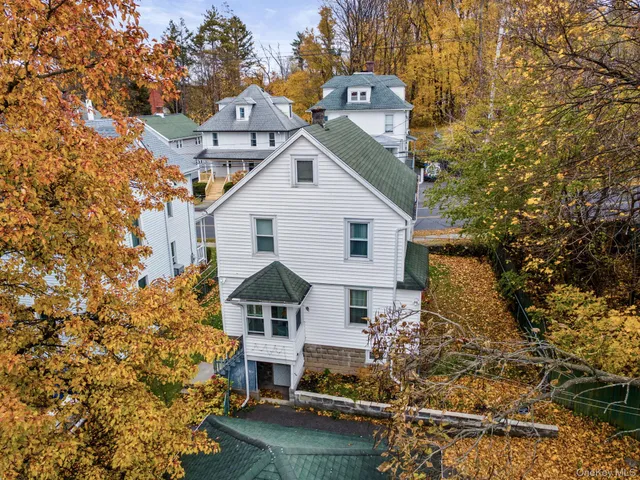 an aerial view of residential houses with outdoor space