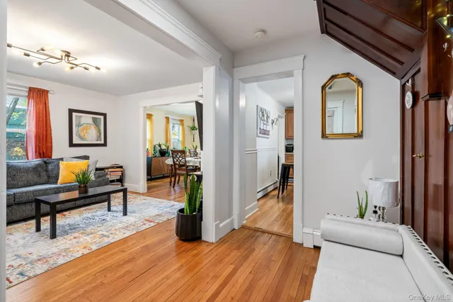 a living room with furniture fireplace and flat screen tv
