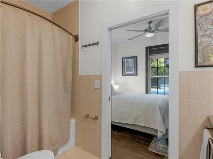 a en suite bathroom with a shower curtain
