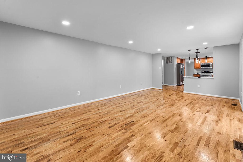 10401 Bald Hill Road Bowie, MD 20721 - Photo 23 of 44 Spacious, modern living area with hardwood floors.