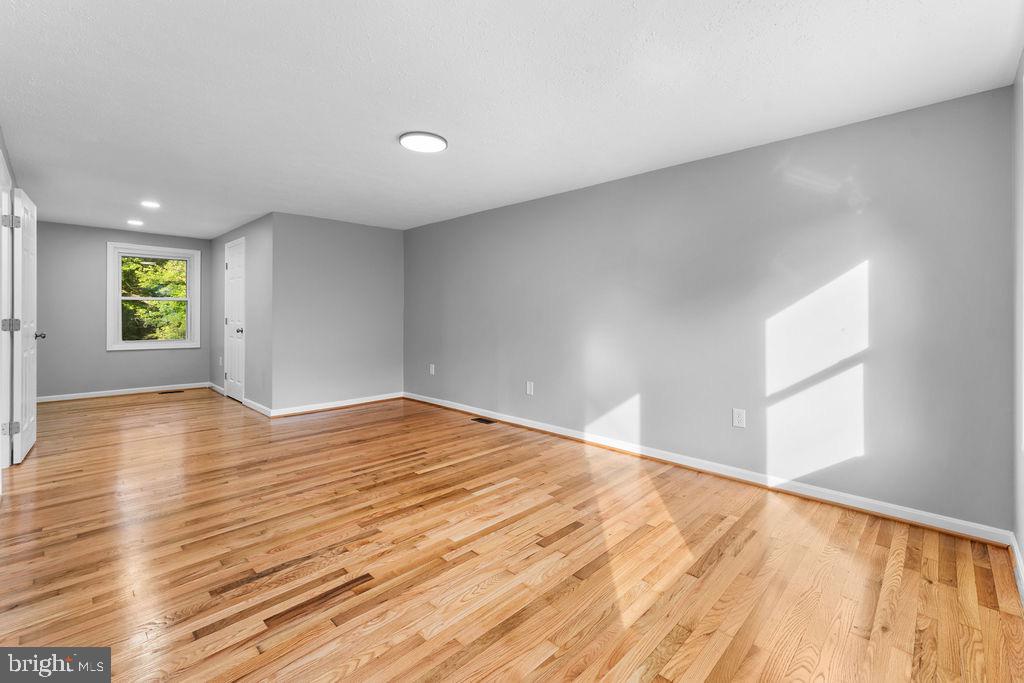 10401 Bald Hill Road Bowie, MD 20721 - Photo 27 of 44 Bright and airy space with warm wood floors.
