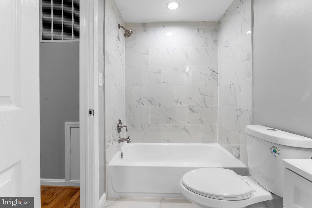 10401 Bald Hill Road Bowie, MD 20721 - Photo 32 of 44 Modern bathroom with elegant marble accents.