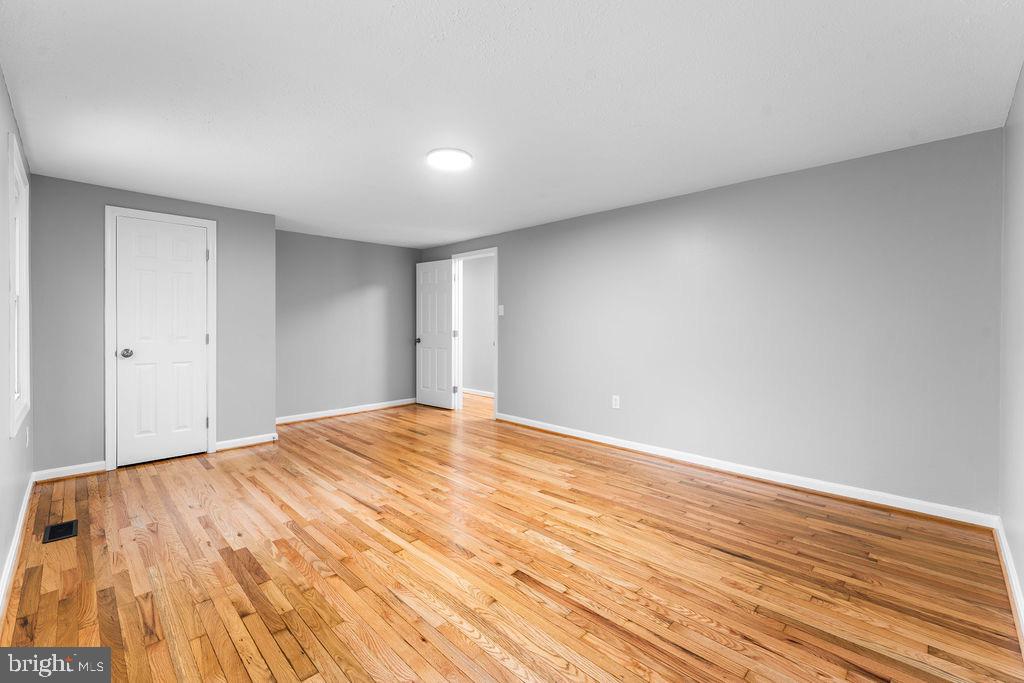 10401 Bald Hill Road Bowie, MD 20721 - Photo 36 of 44 Spacious room with warm wooden floors.