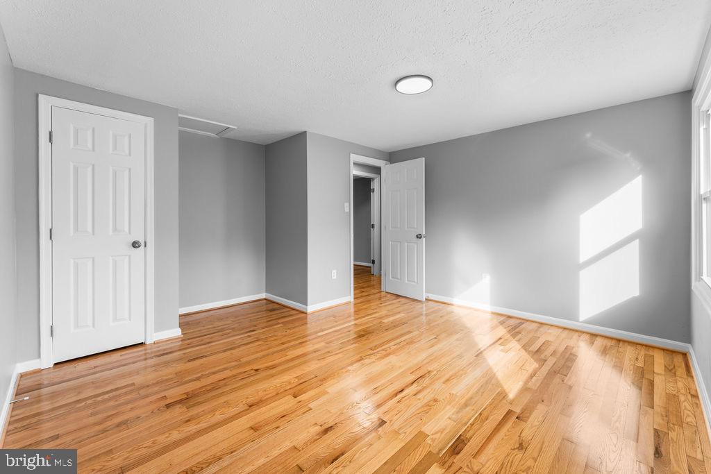 10401 Bald Hill Road Bowie, MD 20721 - Photo 38 of 44 Bright and airy space with warm wood floors.
