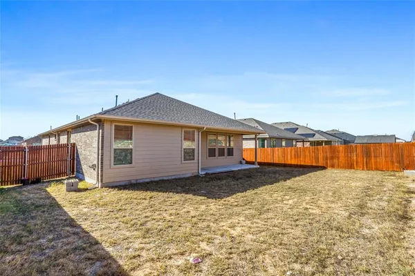 a house view with a garden space