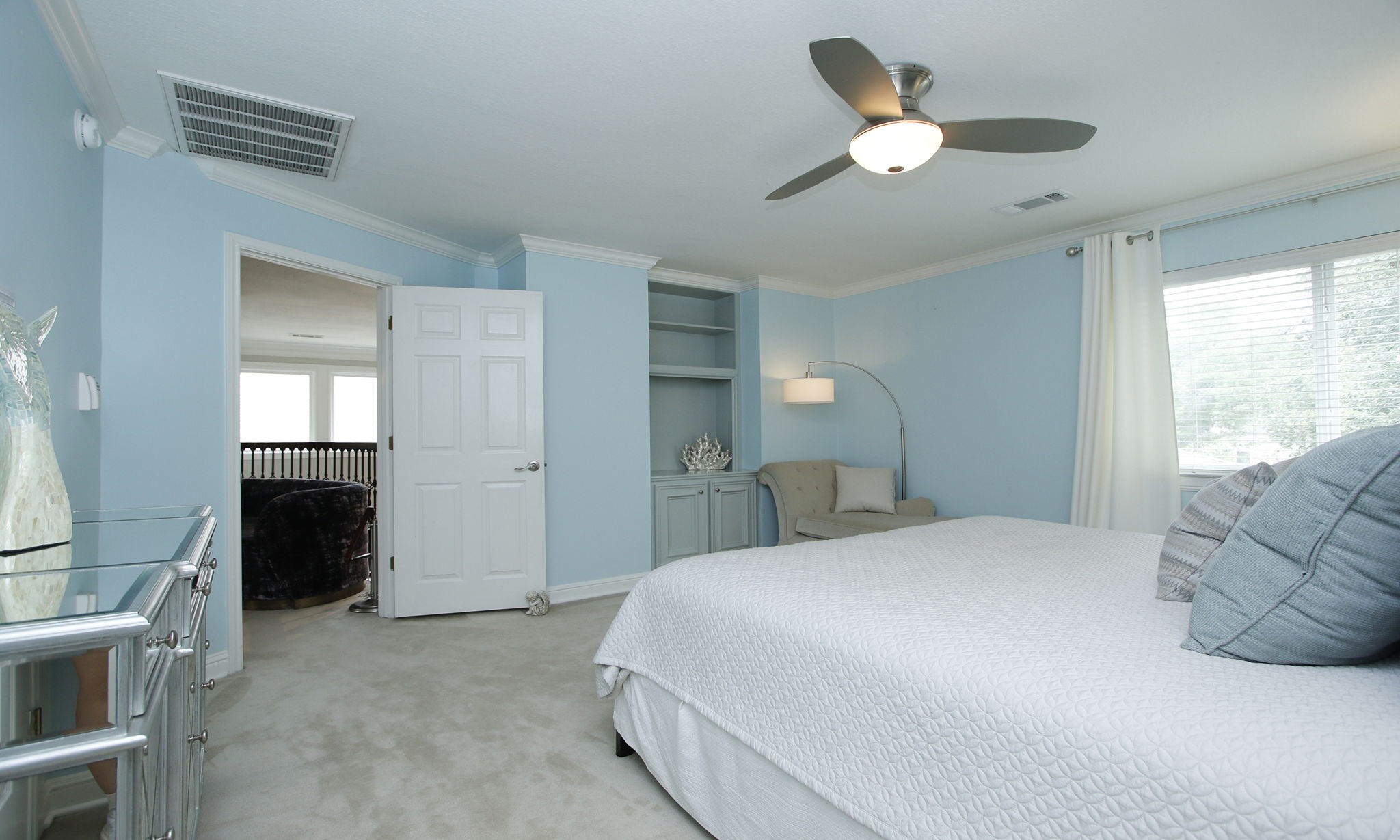 16610 Manningtree Lane Spring, TX 77379 - Photo 43 of 50 This is the third bedroom on the second floor with custom shelves and ceiling fan.