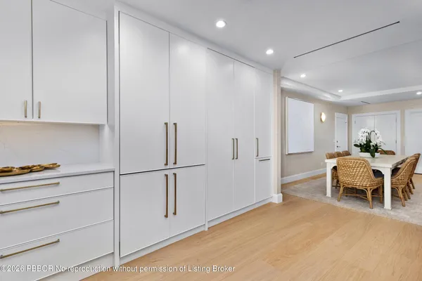 a view of a hallway with furniture
