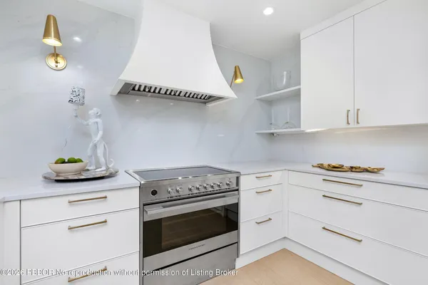 a kitchen with a stove and cabinets