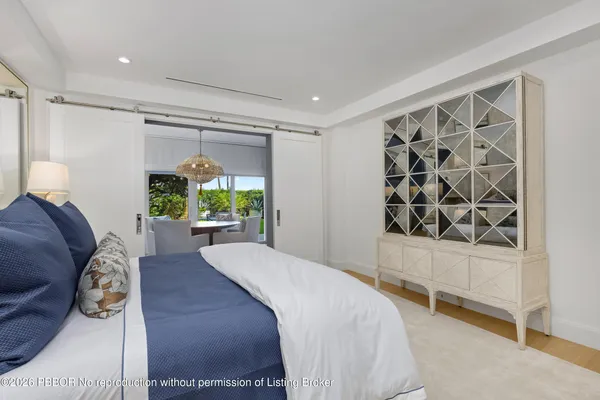 a bed room with a bed and a window