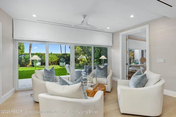 a living room with couch and a large window