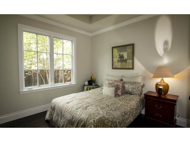 328 Middlefield Road Palo Alto, CA 94301 - Photo 4 of 14 a bedroom with a bed and a lamp on dresser