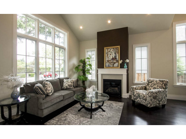 328 Middlefield Road Palo Alto, CA 94301 - Photo 7 of 14 a living room with furniture a fireplace and a large window