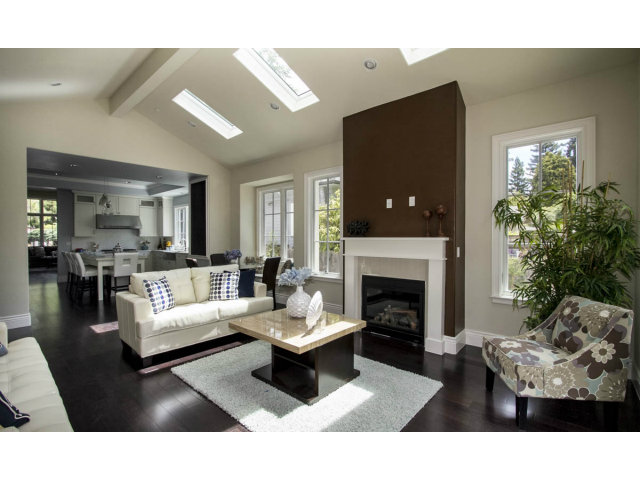 328 Middlefield Road Palo Alto, CA 94301 - Photo 10 of 14 a living room with furniture a fireplace and a flat screen tv
