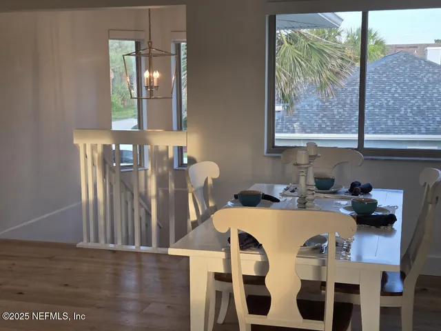 a view of a dining room with furniture and window
