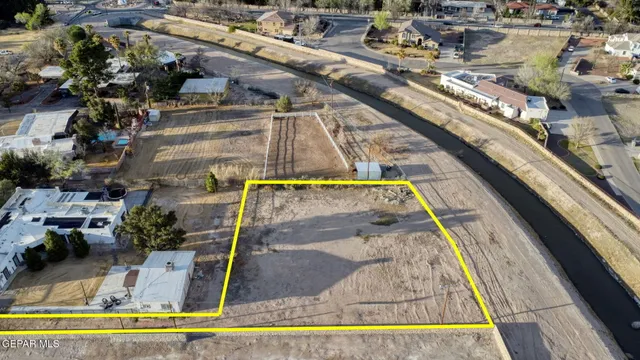 an aerial view of a house with a ocean view