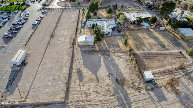 an aerial view of a houses with yard