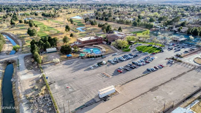 an aerial view of a swimming pool with outdoor space