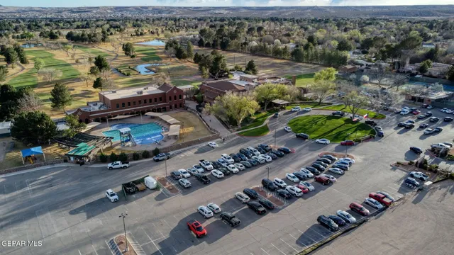 an aerial view of a houses with yard