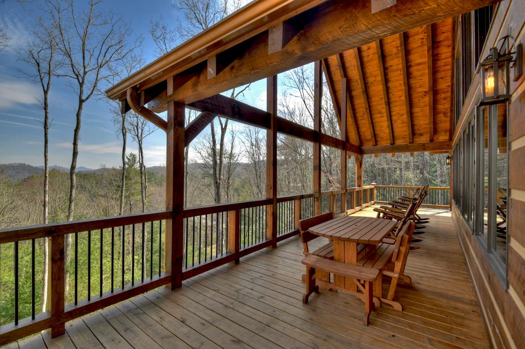 91 Heritage Way Cherry Log, GA 30522 - Photo 11 of 35 a view of balcony with furniture and wooden floor