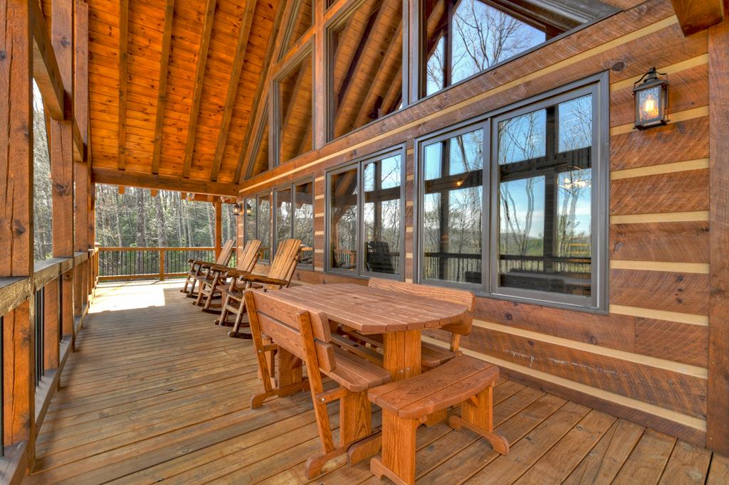 91 Heritage Way Cherry Log, GA 30522 - Photo 12 of 35 a dining room with furniture water view and a floor to ceiling window