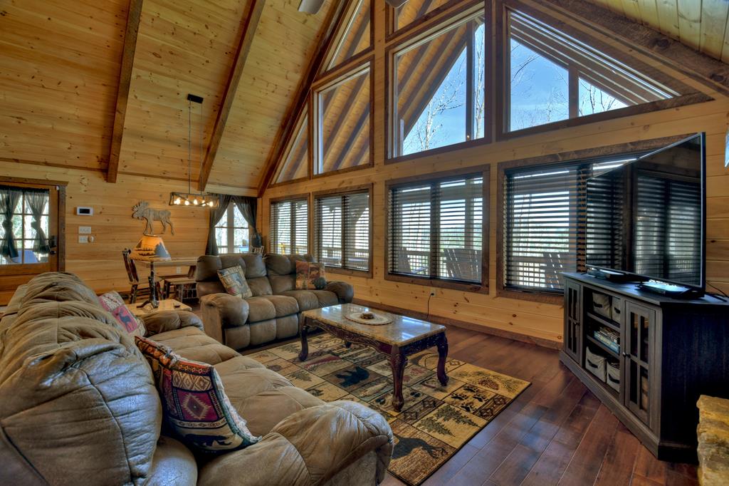 91 Heritage Way Cherry Log, GA 30522 - Photo 19 of 35 a living room with furniture fireplace and flat screen tv