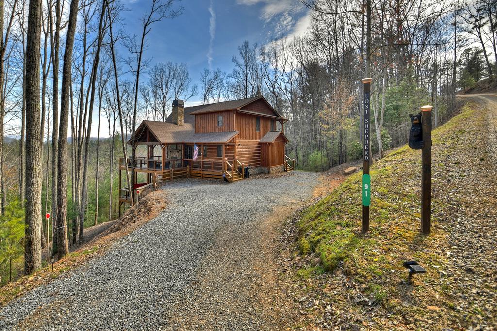 91 Heritage Way Cherry Log, GA 30522 - Photo 6 of 35 a view of a house with a yard