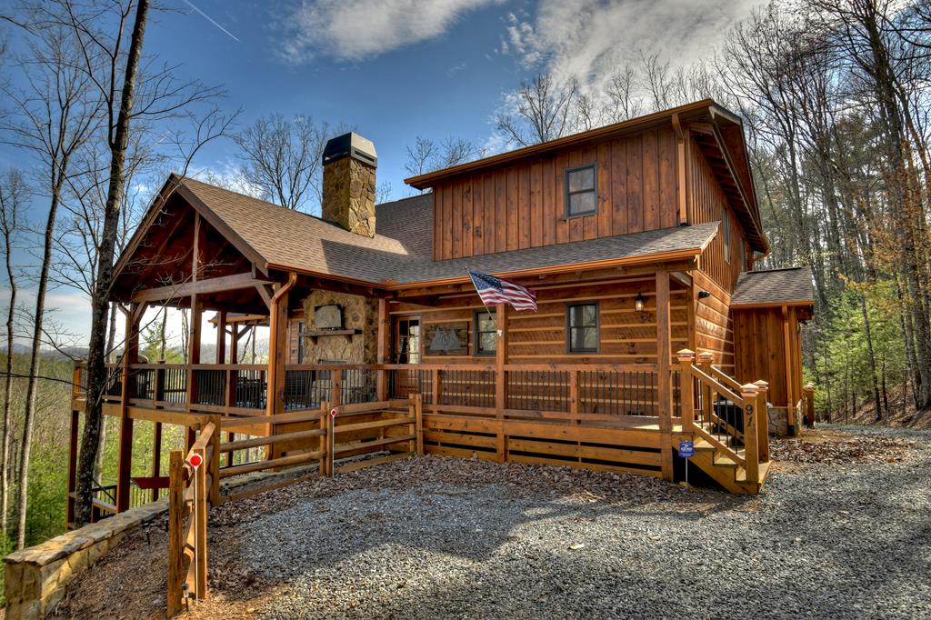 91 Heritage Way Cherry Log, GA 30522 - Photo 7 of 35 a view of a house with a yard and wooden fence