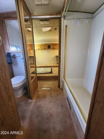 a bathroom with a tub and a shower