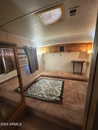 a view of staircase with furniture and rug