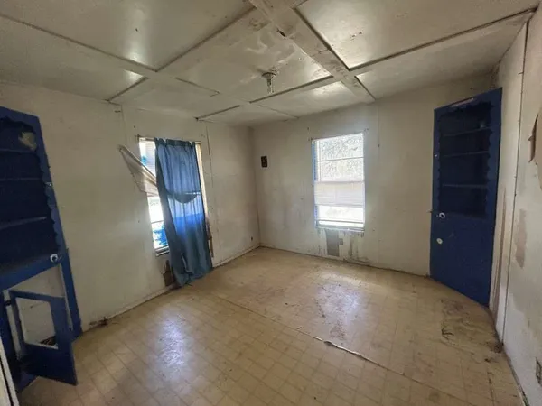 a view of an empty room with a window