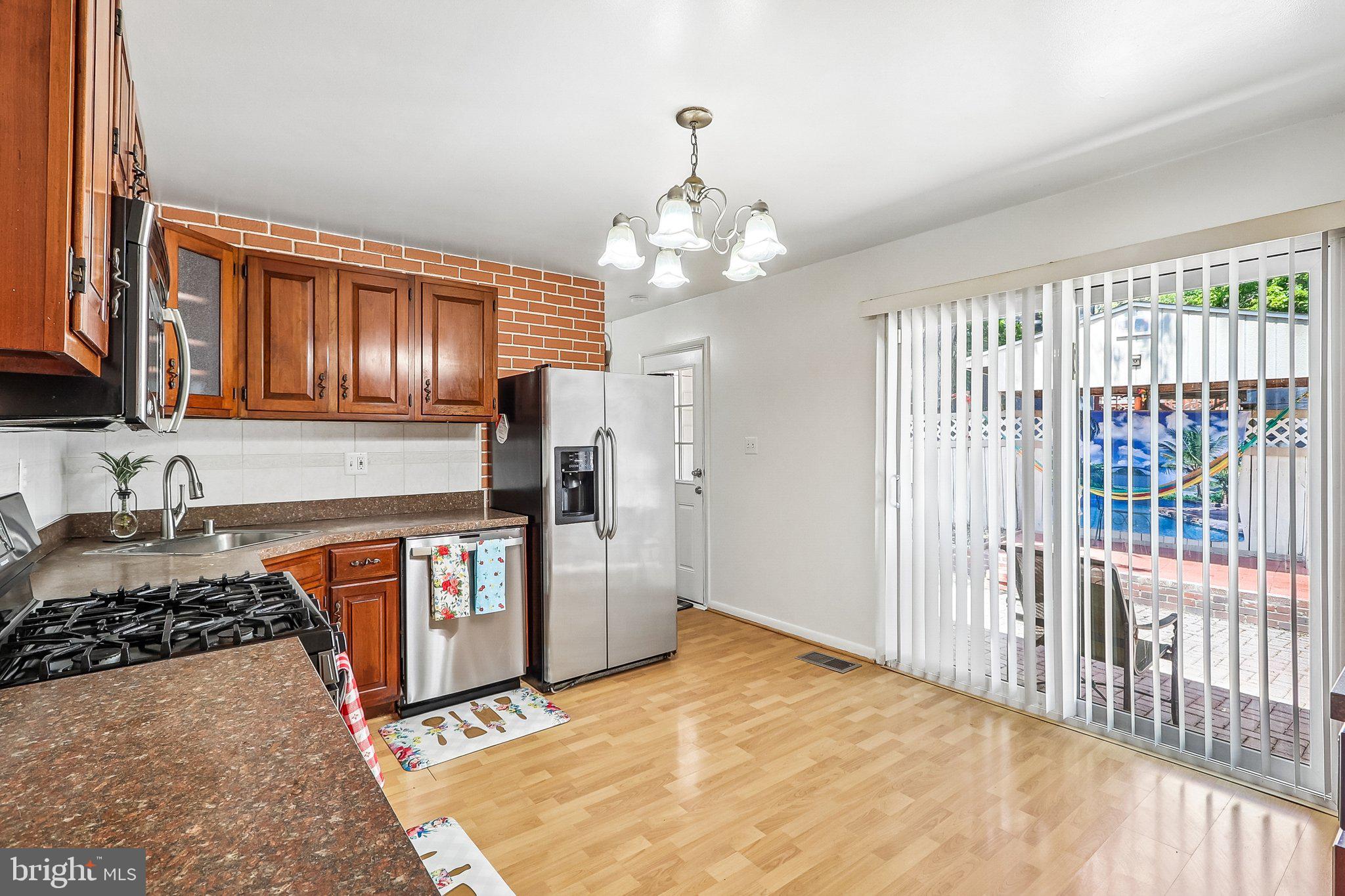 5631 Ellerbie Street Lanham, MD 20706 - Photo 3 of 41 Kitchen w/Exit to Back Yard