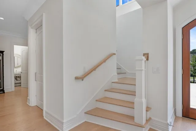 a kitchen with granite countertop cabinets dining table and stainless steel appliances