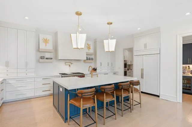 a kitchen with a refrigerator and cabinets